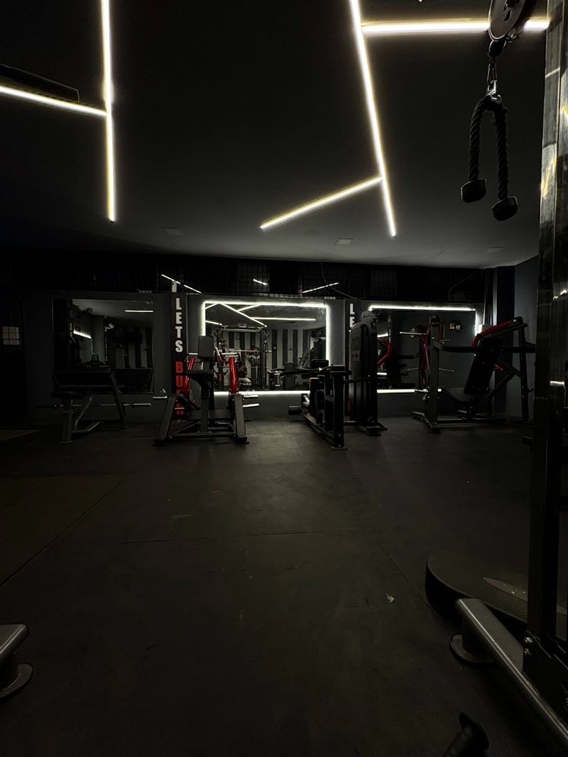 Mirrored training area with LED lighting and machine stations