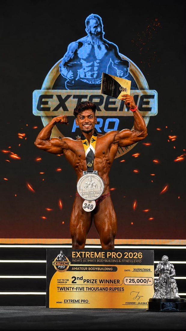 Nickson on stage at Extreme Pro 2026 with his medal, trophy and prize cheque